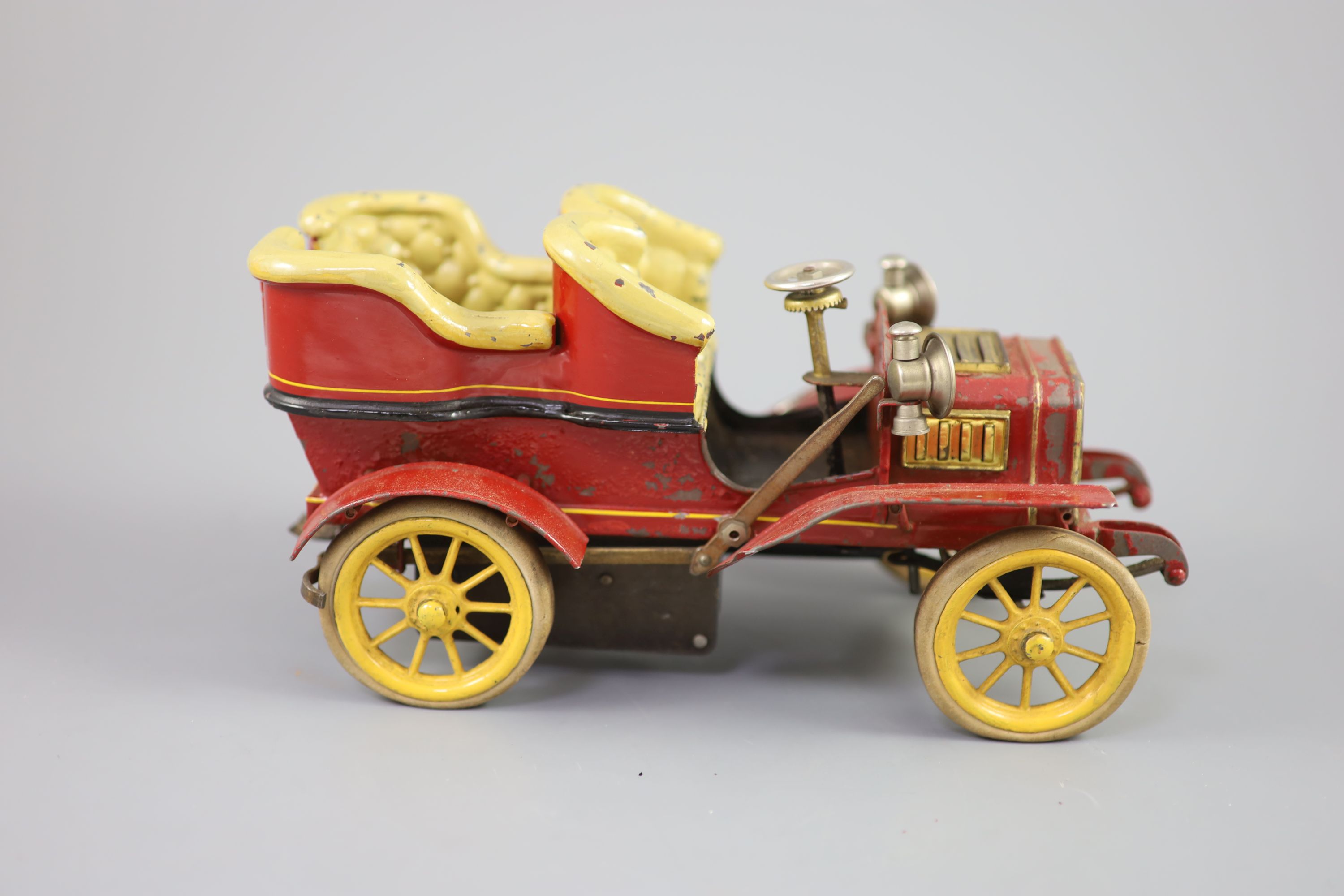 A Bing clockwork tinplate car, c.1906, length 9.5in. width 5in., with original card box and winding key